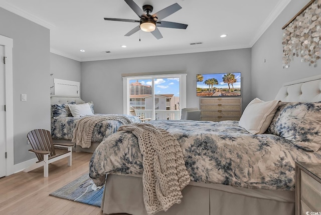 bedroom featuring recessed lighting, visible vents, baseboards, ornamental molding, and light wood finished floors