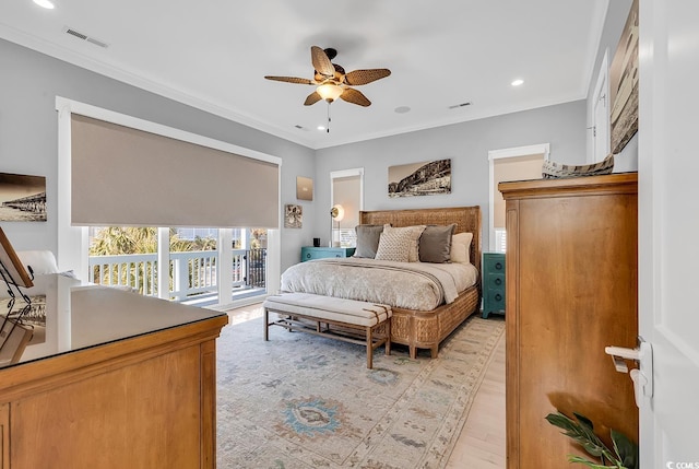 bedroom with access to outside, ornamental molding, light wood-style flooring, and visible vents