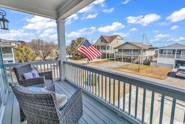 wooden deck with a residential view