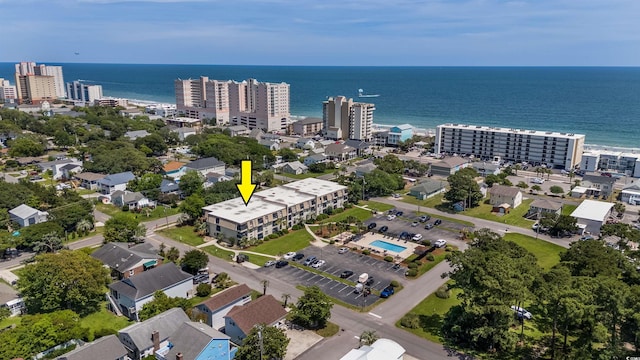 birds eye view of property featuring a water view and a view of city