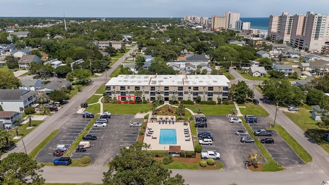 birds eye view of property featuring a water view and a view of city