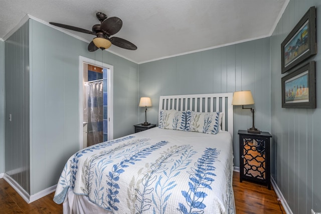 bedroom featuring ornamental molding, a ceiling fan, baseboards, and wood finished floors