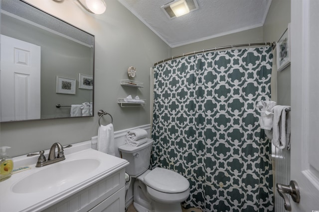 full bathroom featuring visible vents, toilet, vanity, crown molding, and a textured ceiling