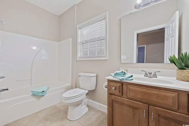 bathroom featuring toilet, vanity, baseboards,  shower combination, and tile patterned floors