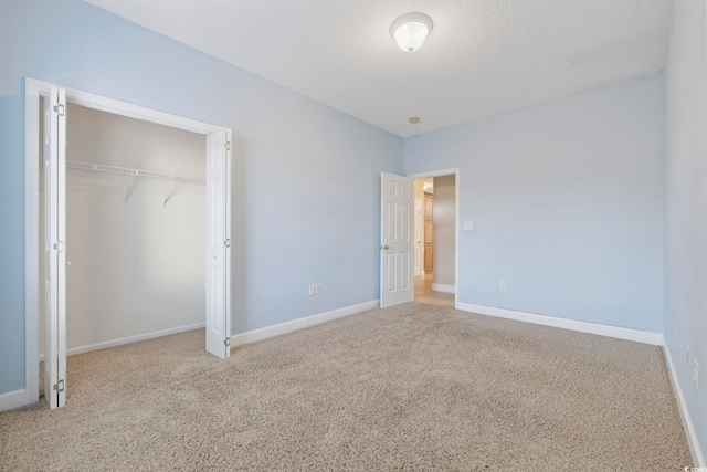 160 Lazy Willow Ln Unit 204, Myrtle Beach, SC 29577 - unfurnished bedroom featuring carpet, a closet, and baseboards