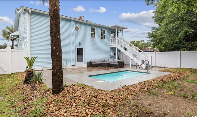 214 2nd Ave S, North Myrtle Beach, SC 29582 - back of house with an outdoor living space, a fenced backyard, a patio, and stairs