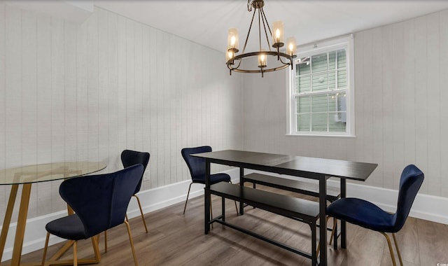 214 2nd Ave S, North Myrtle Beach, SC 29582 - dining space featuring wood finished floors, a chandelier, and wooden walls