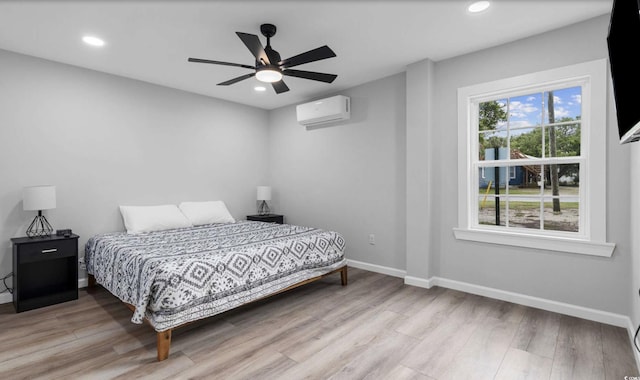 214 2nd Ave S, North Myrtle Beach, SC 29582 - bedroom with an AC wall unit, wood finished floors, recessed lighting, and ceiling fan
