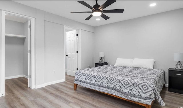 214 2nd Ave S, North Myrtle Beach, SC 29582 - bedroom with wood finished floors, recessed lighting, a ceiling fan, and a spacious closet