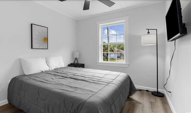 214 2nd Ave S, North Myrtle Beach, SC 29582 - bedroom featuring wood finished floors, ceiling fan, and ornamental molding