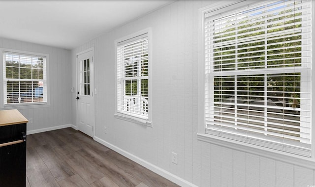 214 2nd Ave S, North Myrtle Beach, SC 29582 - doorway featuring dark wood finished floors and baseboards