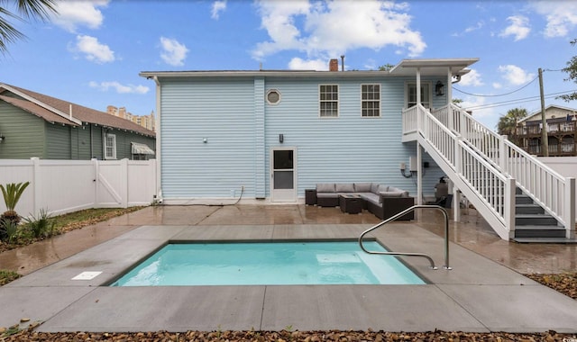 214 2nd Ave S, North Myrtle Beach, SC 29582 - back of property with outdoor lounge area, a patio area, a fenced backyard, and stairs