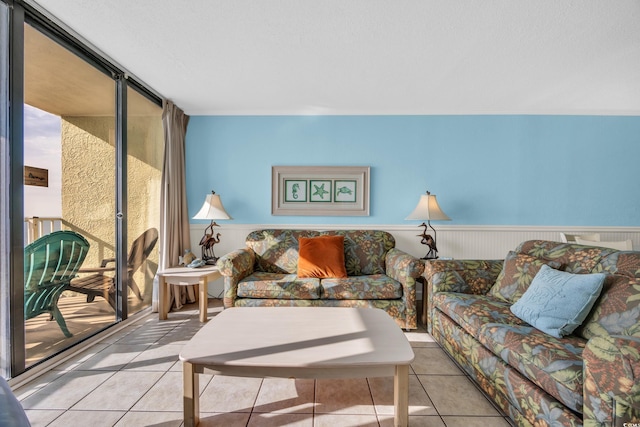 9400 Shore Dr Unit 722, Myrtle Beach, SC 29572 - living room with tile patterned floors and a wainscoted wall