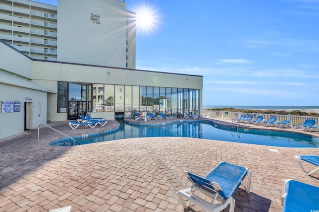 9400 Shore Dr Unit 722, Myrtle Beach, SC 29572 - community pool featuring a patio area
