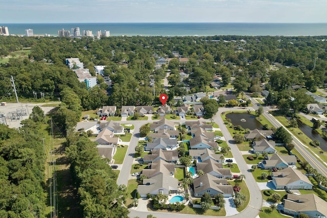 bird's eye view with a residential view and a water view