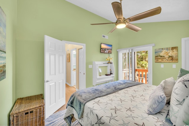 bedroom with visible vents, ceiling fan, wood finished floors, access to outside, and vaulted ceiling