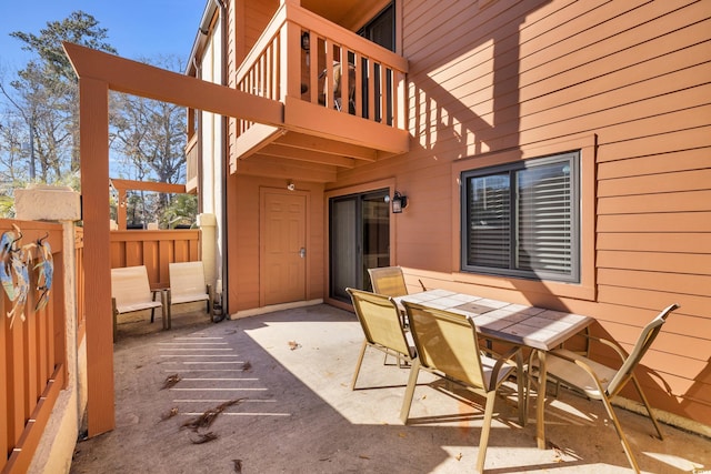 view of patio / terrace featuring outdoor dining space and a balcony