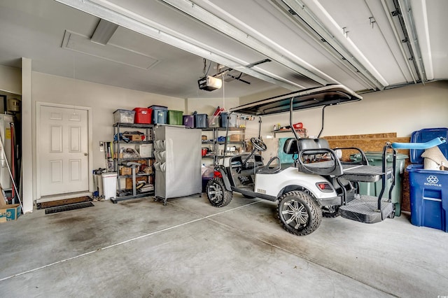 garage with freestanding refrigerator and a garage door opener