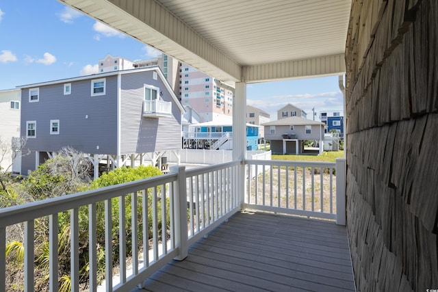 wooden terrace featuring a residential view