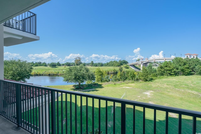 balcony featuring a water view