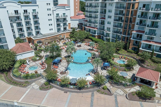 bird's eye view of a pool area and apartment complex