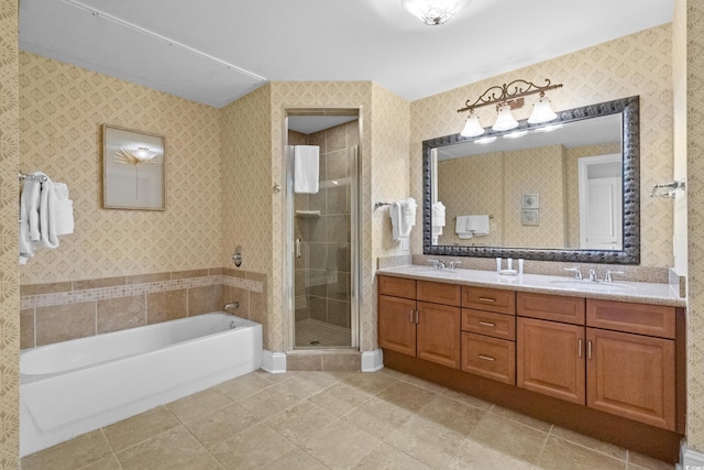 full bath with a stall shower, double vanity, a bath, and tile patterned flooring