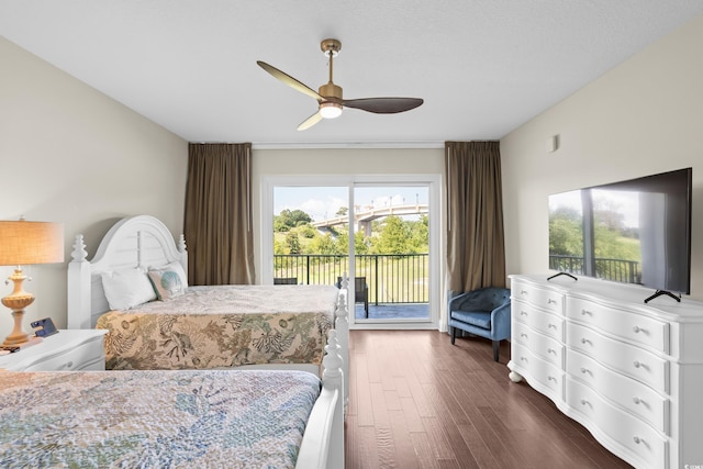 bedroom with access to exterior, dark wood-style floors, and ceiling fan