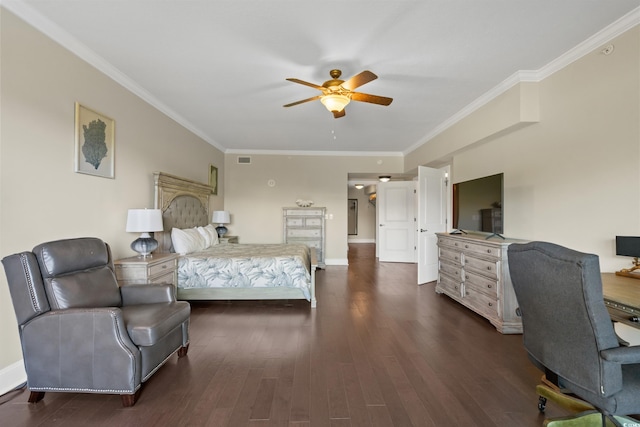 bedroom featuring dark wood finished floors, ornamental molding, baseboards, a ceiling fan, and a desk