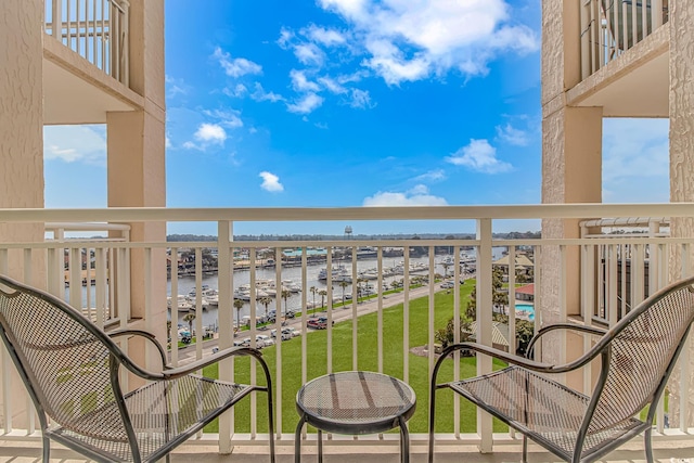 balcony featuring a water view