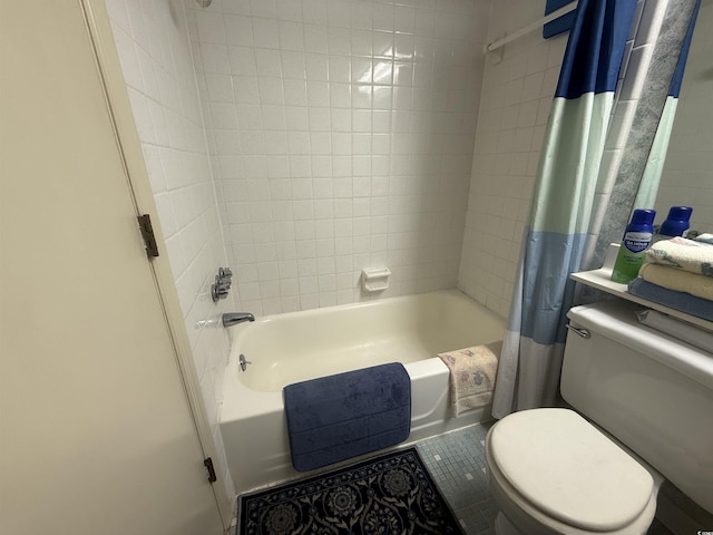 bathroom featuring tile patterned flooring, toilet, and shower / bathtub combination with curtain