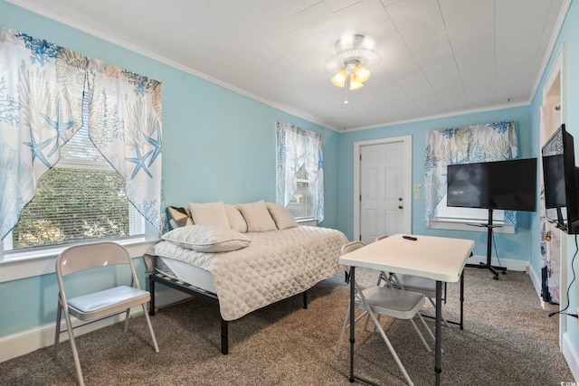 carpeted bedroom featuring baseboards and crown molding