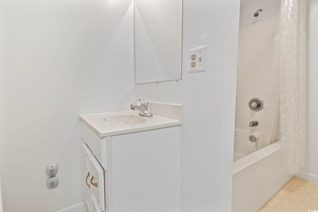 full bathroom featuring vanity and shower / bath combo with shower curtain