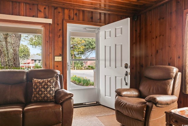 interior space featuring a healthy amount of sunlight and wooden walls