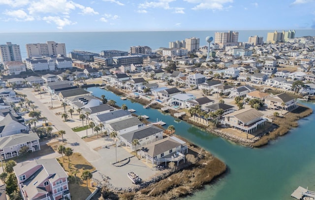 bird's eye view featuring a view of city and a water view