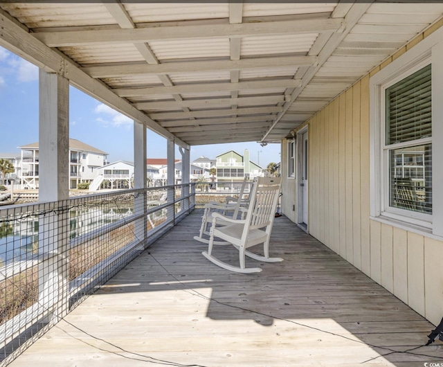 wooden terrace with a residential view