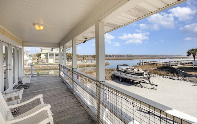 deck featuring a dock and a water view