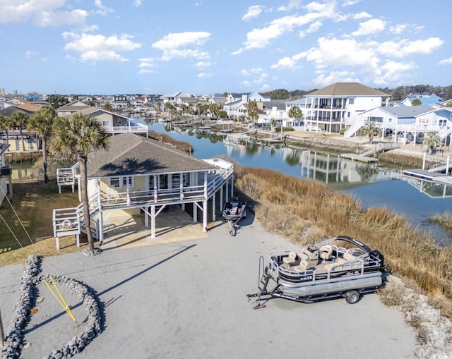 exterior space with a water view and a residential view