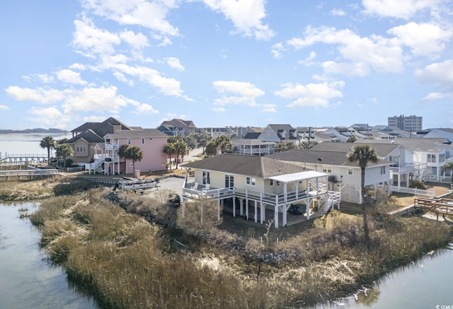 aerial view featuring a water view and a residential view