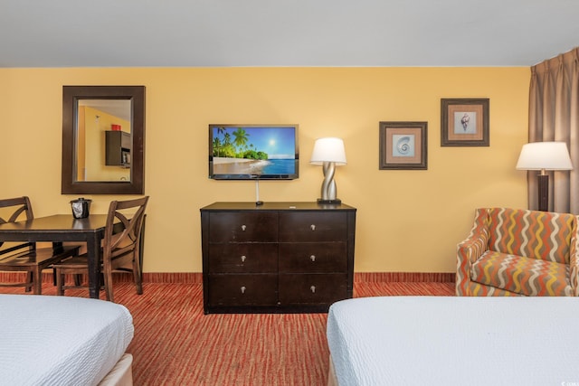 carpeted bedroom with baseboards