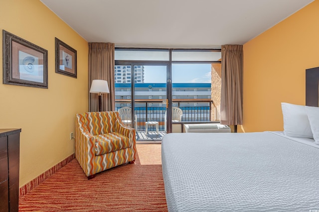 bedroom featuring carpet floors, access to exterior, and floor to ceiling windows