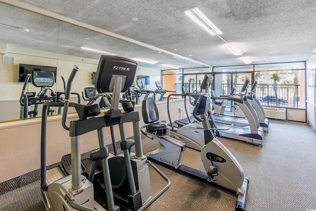 gym with a textured ceiling