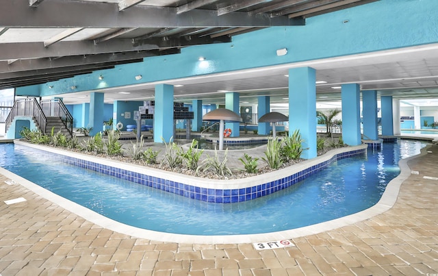 community pool featuring a patio area