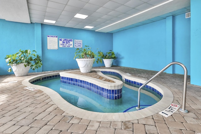 indoor pool with an indoor hot tub