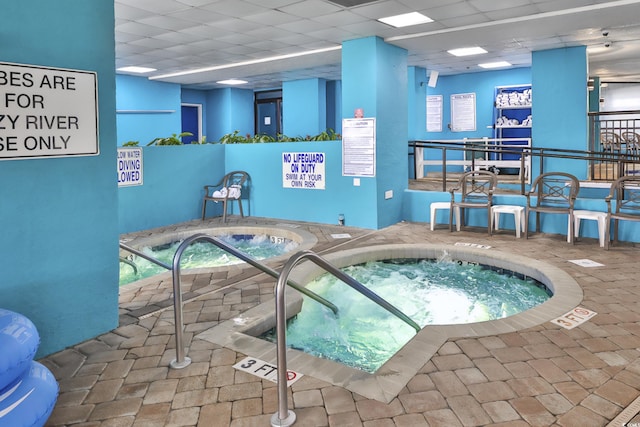 view of pool featuring an indoor hot tub