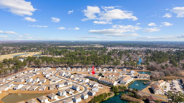 drone / aerial view featuring a water view and a residential view