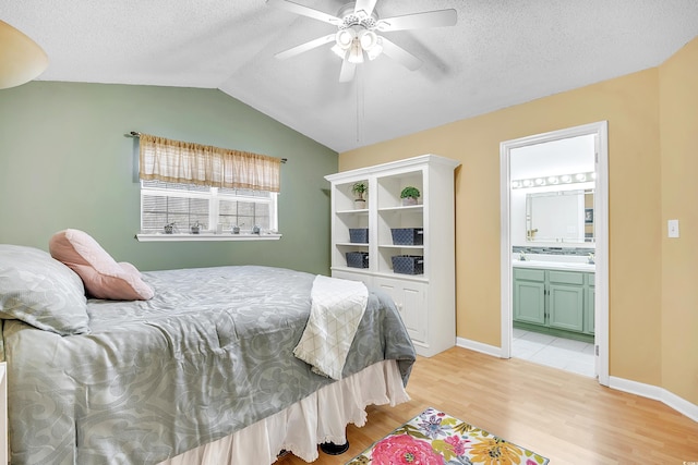 6634 Cinnamon Fern Ln, Myrtle Beach, SC 29588 - bedroom with lofted ceiling, ensuite bath, ceiling fan, a textured ceiling, and light wood-style floors