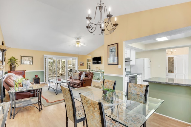 6634 Cinnamon Fern Ln, Myrtle Beach, SC 29588 - dining room with lofted ceiling, light wood finished floors, and ceiling fan with notable chandelier