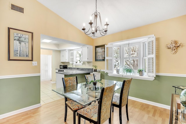 6634 Cinnamon Fern Ln, Myrtle Beach, SC 29588 - dining area with a chandelier, plenty of natural light, visible vents, and baseboards