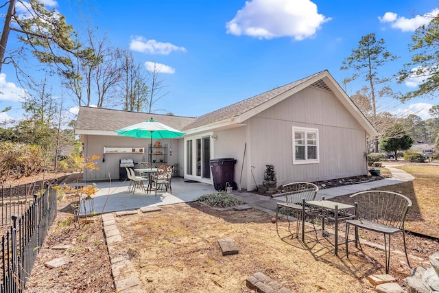 6634 Cinnamon Fern Ln, Myrtle Beach, SC 29588 - rear view of property with a patio, french doors, a shingled roof, and fence