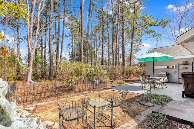 6634 Cinnamon Fern Ln, Myrtle Beach, SC 29588 - view of patio / terrace featuring outdoor dining space and fence